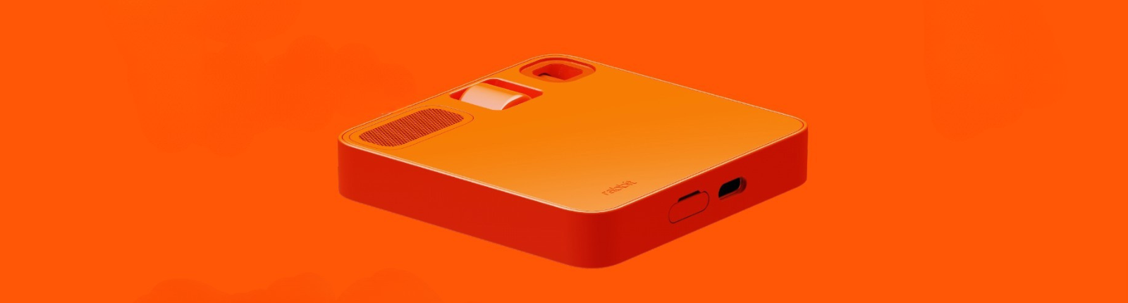 Oranage Rabbit AI Device laying facedown