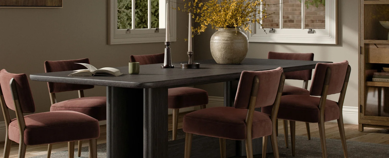Thoughtfully styled dining room scene with a dining table and chairs set for gathering.