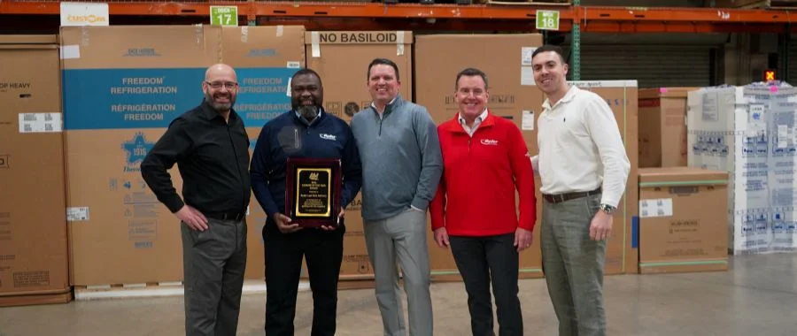 The Abt Carrier of the Year Award Ceremony: Logistics manager Gary Quinton and Jake Abt stand beside Ryder execs Joel Eigege, Brian Jackson and Jeff Bishop