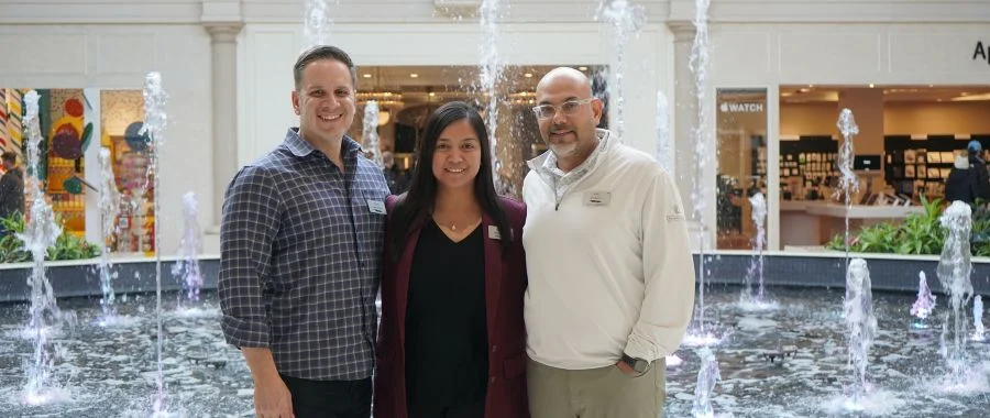 John Pappas, Richie Palmero and Kal Madhiwala in the Abt Atrium in front of the fountain