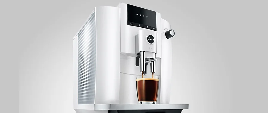 A white Jura E4 coffee machine