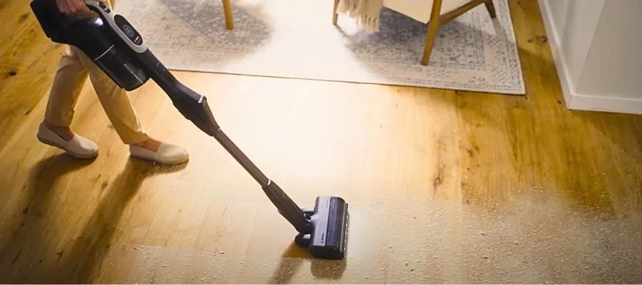 The Bosch Unlimited 10 cleaning dirty hardwood floors.