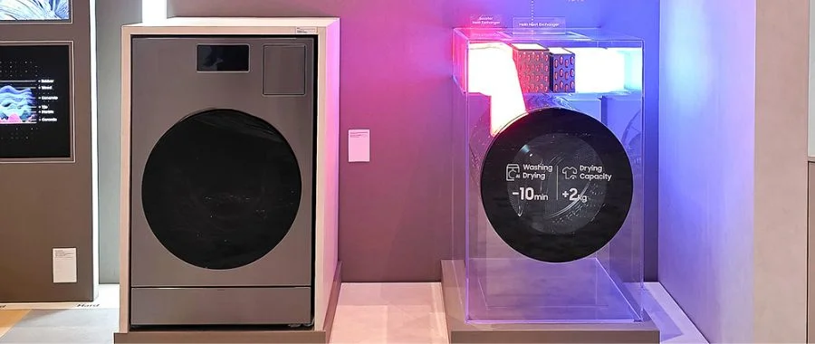 Samsung Bespoke AI Laundry Combo at CES 2026 beside a clear display showcasing the heat removal