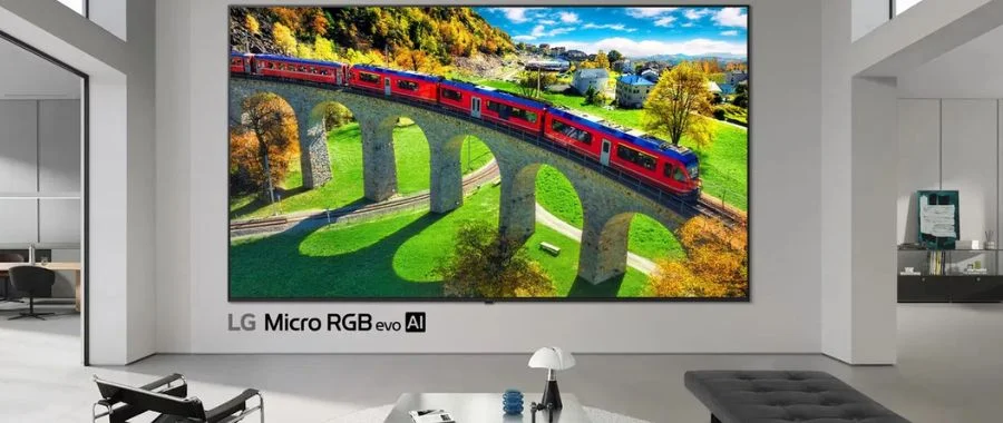 The LG Micro RGB evo TV displaying a train riding over a valley.