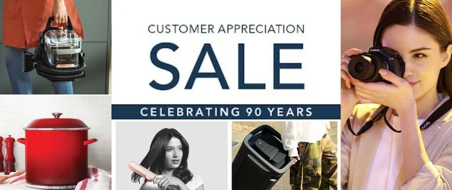 A collection of Abt products like a red Le Creuset stockpot, a Canon camera and Dyson Airstrait, including the text Customer Appreciation Sale, Celebrating 90 Years