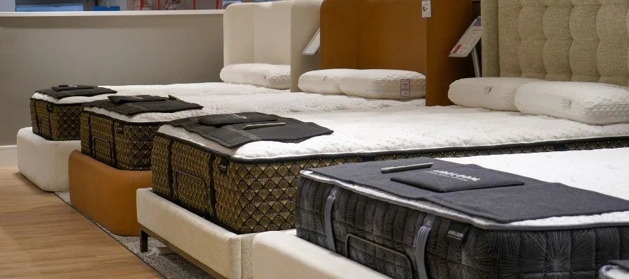 An image of four mattresses with stylish headboards in the new Abt mattress department.