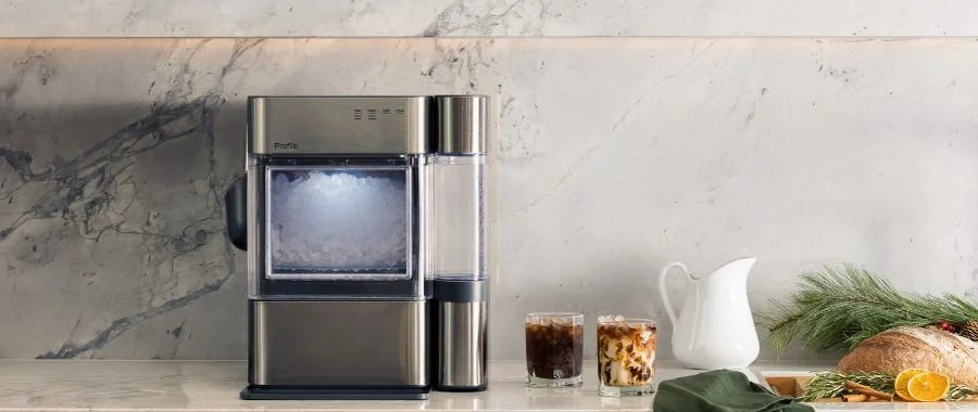GE Profile Opal ice maker on a marble kitchen counter.