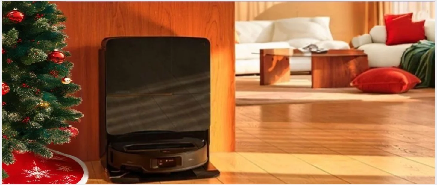 The Roborock Saros Z70 robotic vacuum charging on its designated dock next to a Christmas tree.