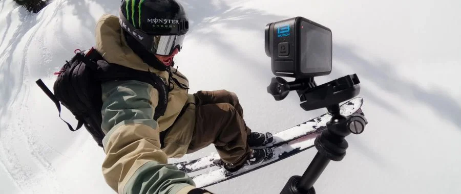 A man doing a jump while skiing and recording himself with the GoPro HERO13.