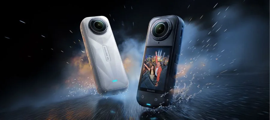 Black and white Insta360 X5 cameras splashing in water.