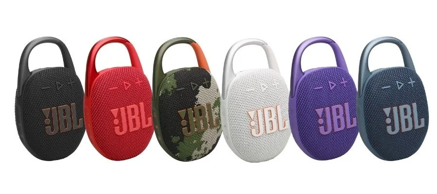 JBL Clip 5 speakers in black, red, camo, white, purple and blue against a white background.