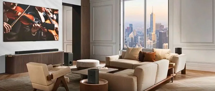 The LG Sound Suite setup in a modern city apartment living room.