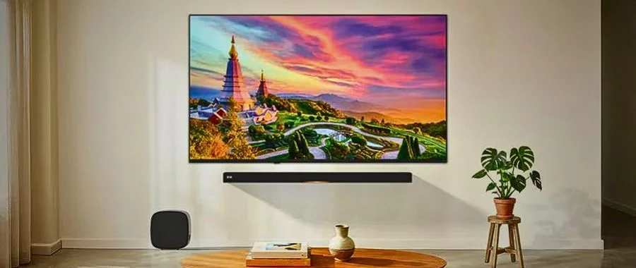 The LG QNED75B TV wall-mounted in modern living room.