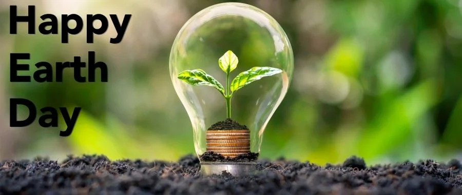 A small sprout inside a lightbulb next to Happy Earth Day text. 