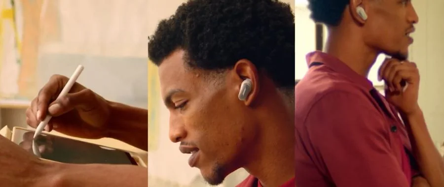 A man listening with the Bose QuietComfort Ultra Earbuds 2 as he uses an iPad.