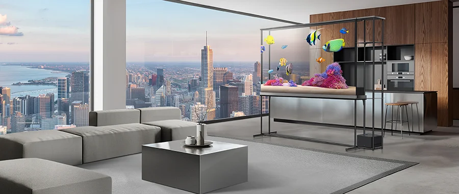 The LG OLED T TV sitting in front of a living room displaying a transparent fish tank scene, while you can see the kitchen through the screen