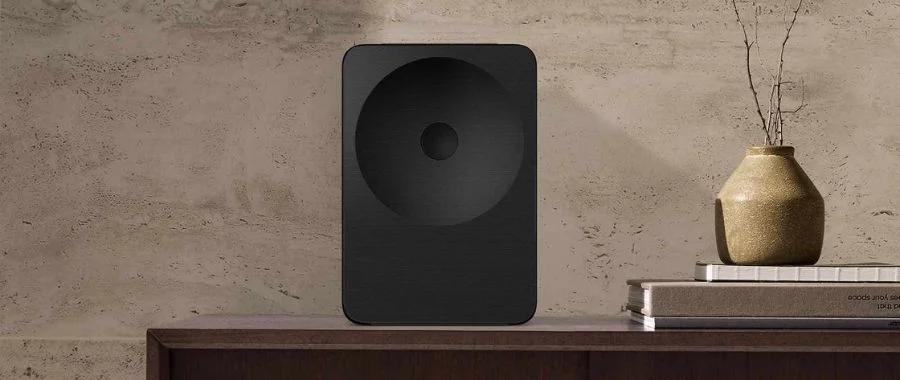 The Samsung Music Studio 7 speaker placed on a wooden surface.