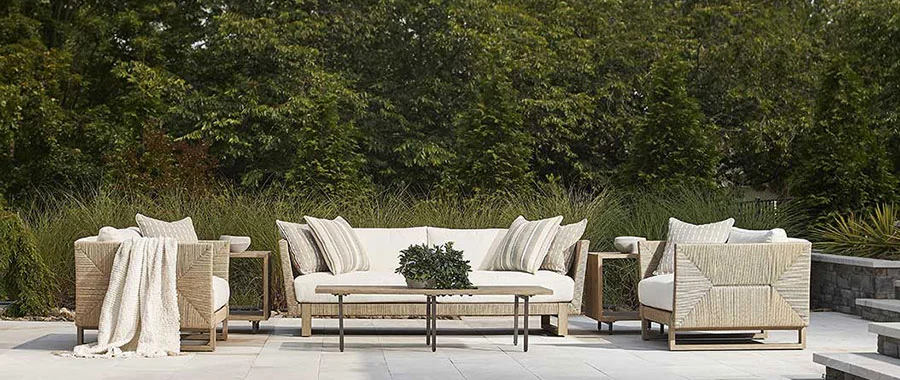 outdoor loveseat two armchairs with woven design around a rectangular coffee table