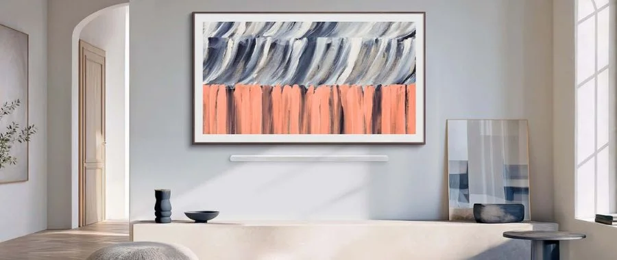 The Samsung Frame TV mounted to the wall in a modern home.