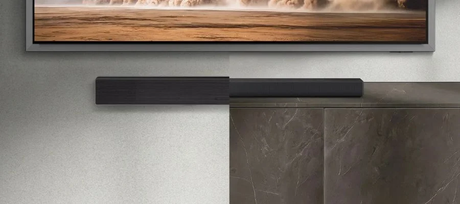 Side-by-side photos showing the Samsung HW-QS90H soundbar wall-mounted and set on a TV stand.