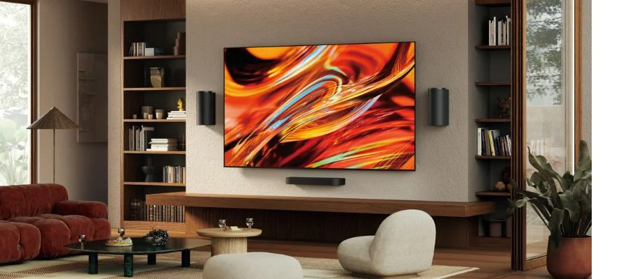 A wall-mounted Sony Bravia 7 II TV installed in a modern yet cozy living room.