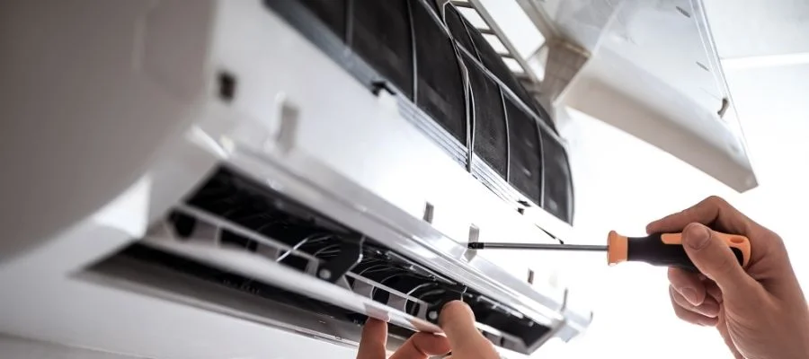 A ceiling air conditioner getting installed.