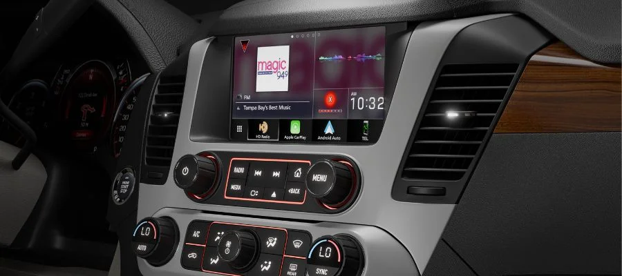 A multimedia receiver with Apple CarPlay and Android Auto installed in a car.