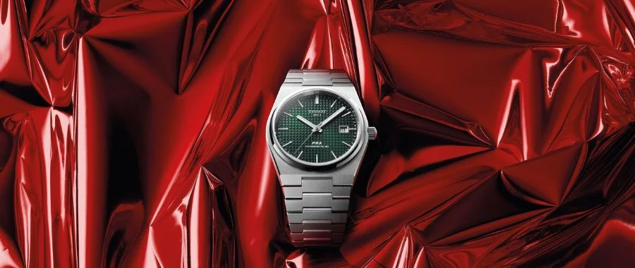 Silver-tone Tissot men's watch with a green face