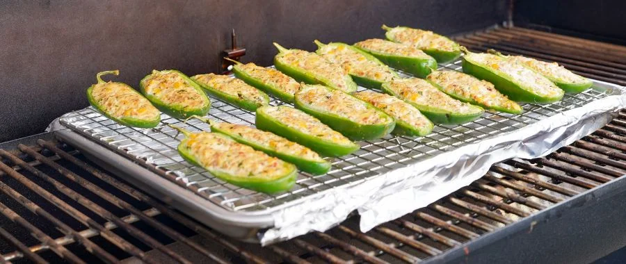 A tray of Weber Mexican Street Corn Jalepeño Poppers on a Weber smoker at Abt's Grill Fest