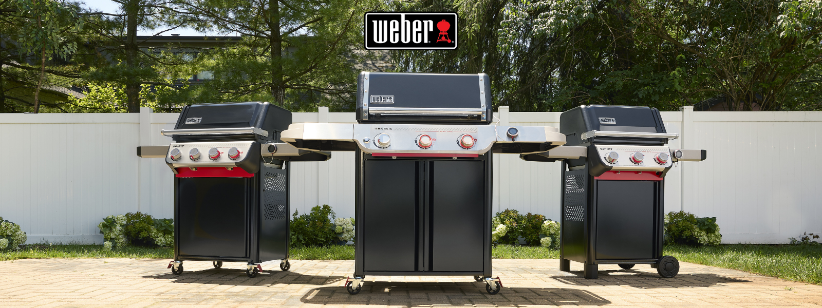 Lifestyle shot of 3 weber grills two spirits and a genesis in an nice outdoor setting