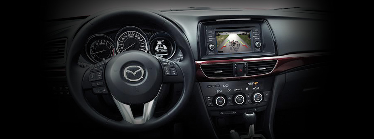 Black car steering wheel and audio system screen