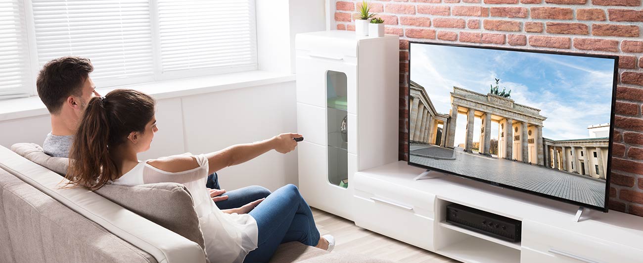 Two people watching TV