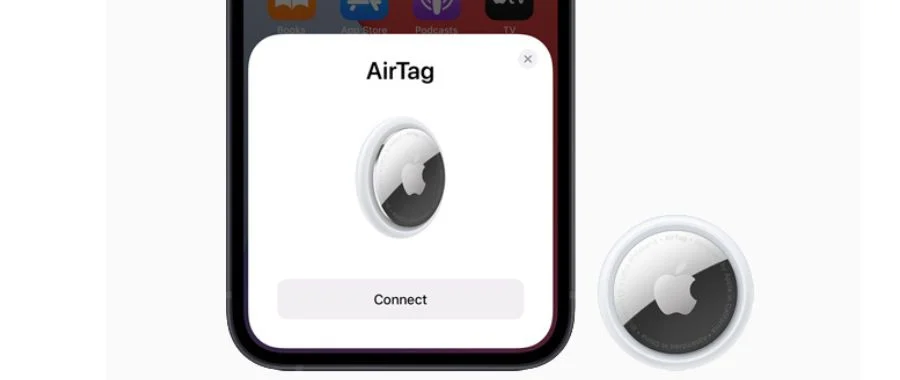 An iPhone and AirTag ready to be paired together.