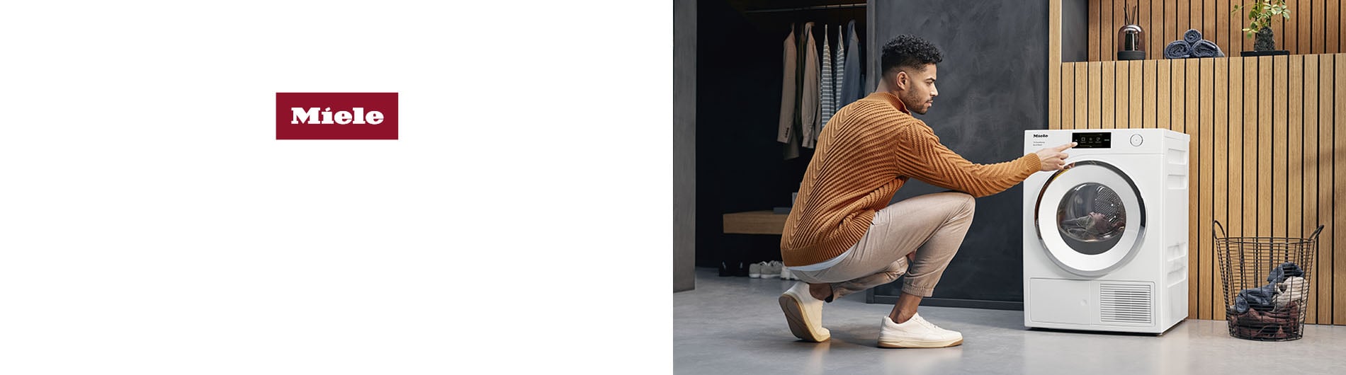 Man crouched down doing laundry