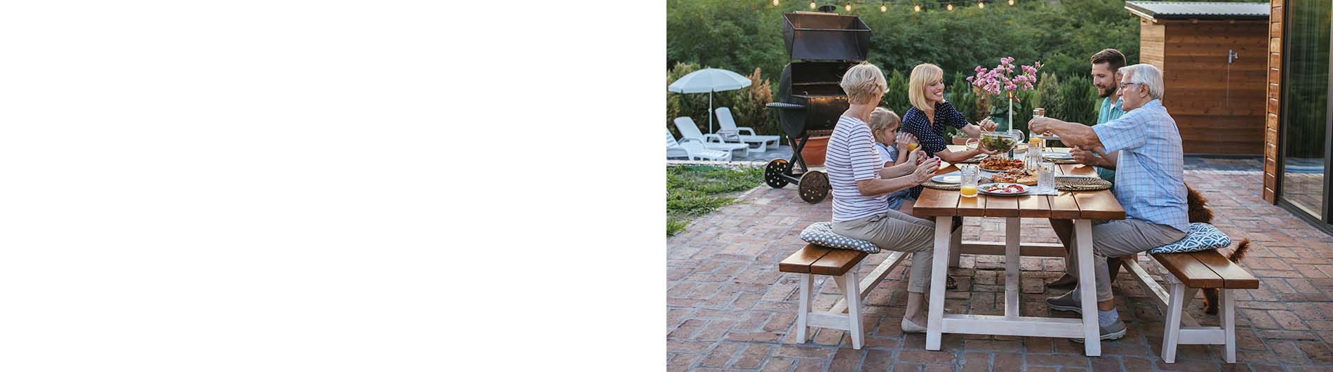 Family enjoying time around a picnic table