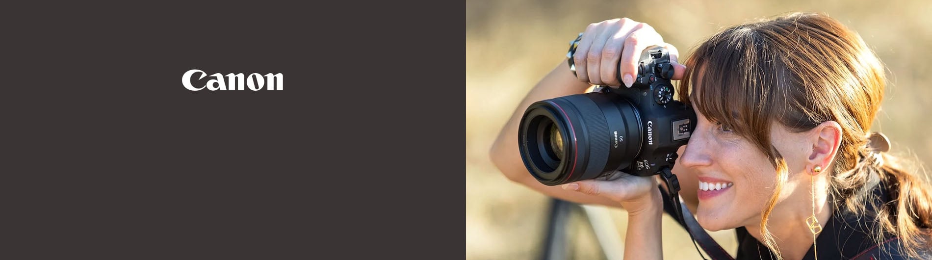 Woman using camera outdoors
