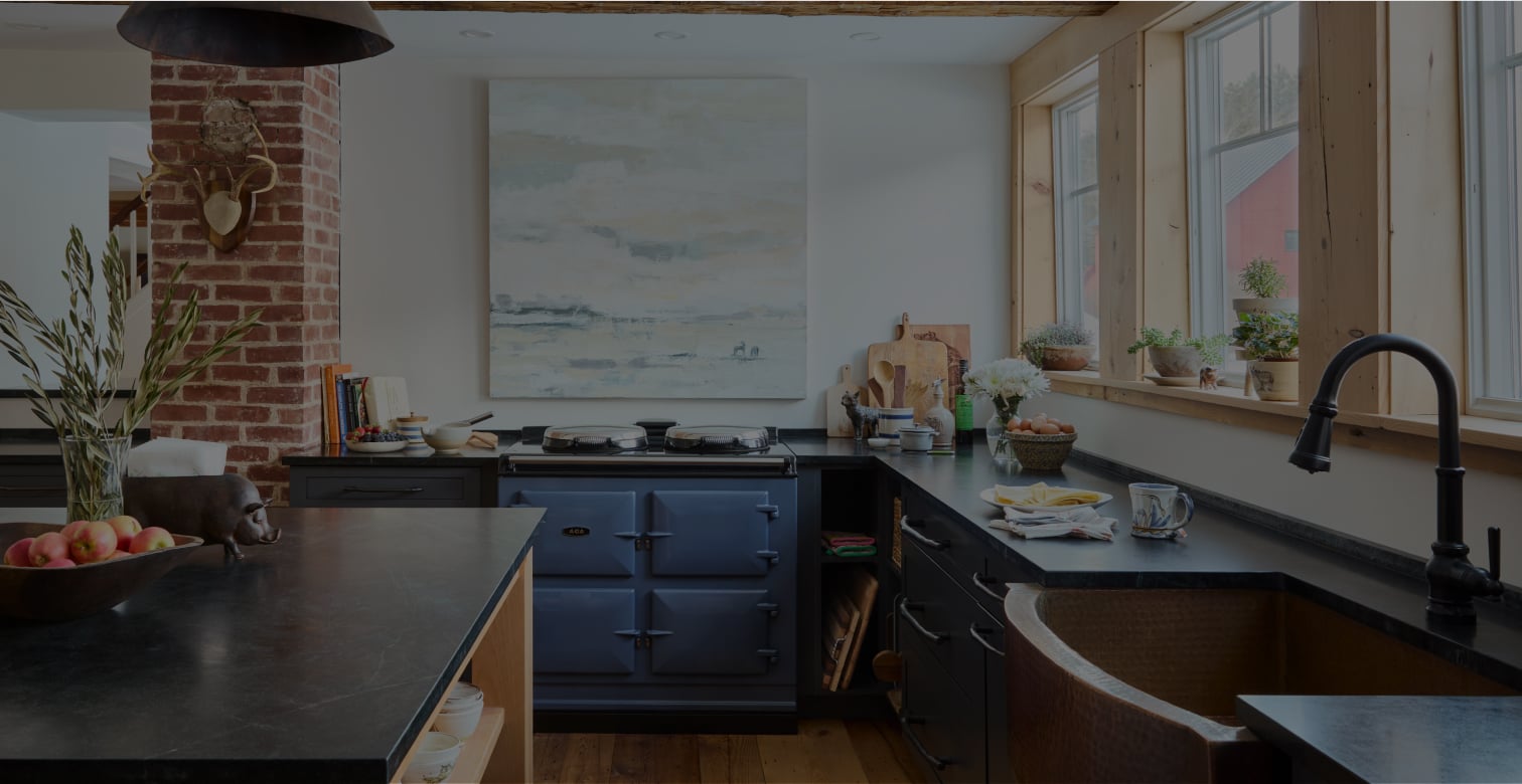 Elegantly styled kitchen featuring an AGA range, blending modern design with classic cooking functionality