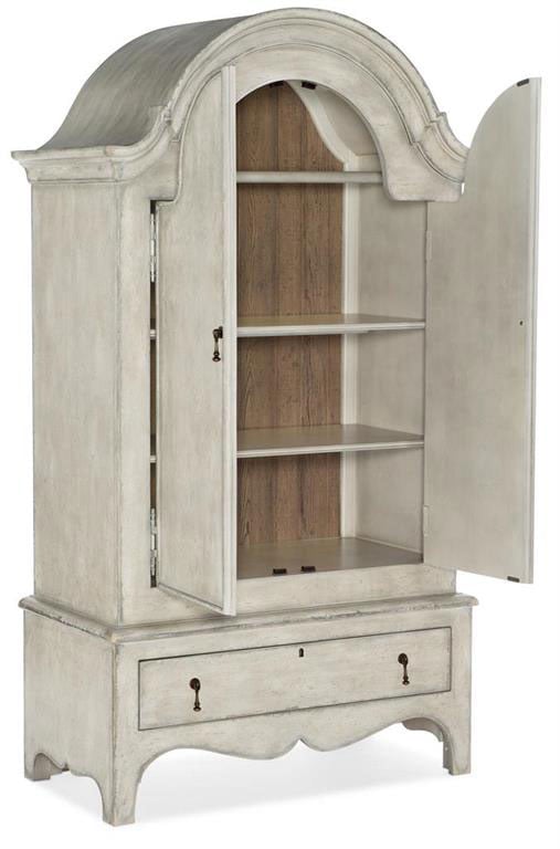 A white armoire with two doors and a drawer, open to show shelves