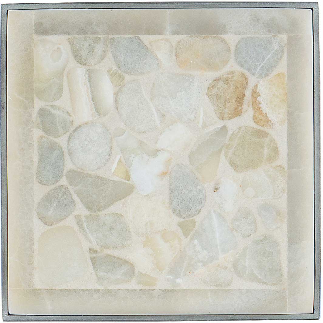 A close-up of a stone table top with a metal frame.