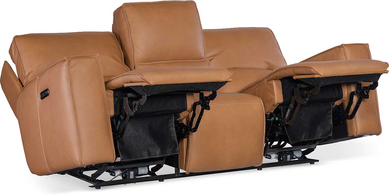 Side view of tan leather reclining sofa with power controls on the outer arm, showing the release switches and mechanism.