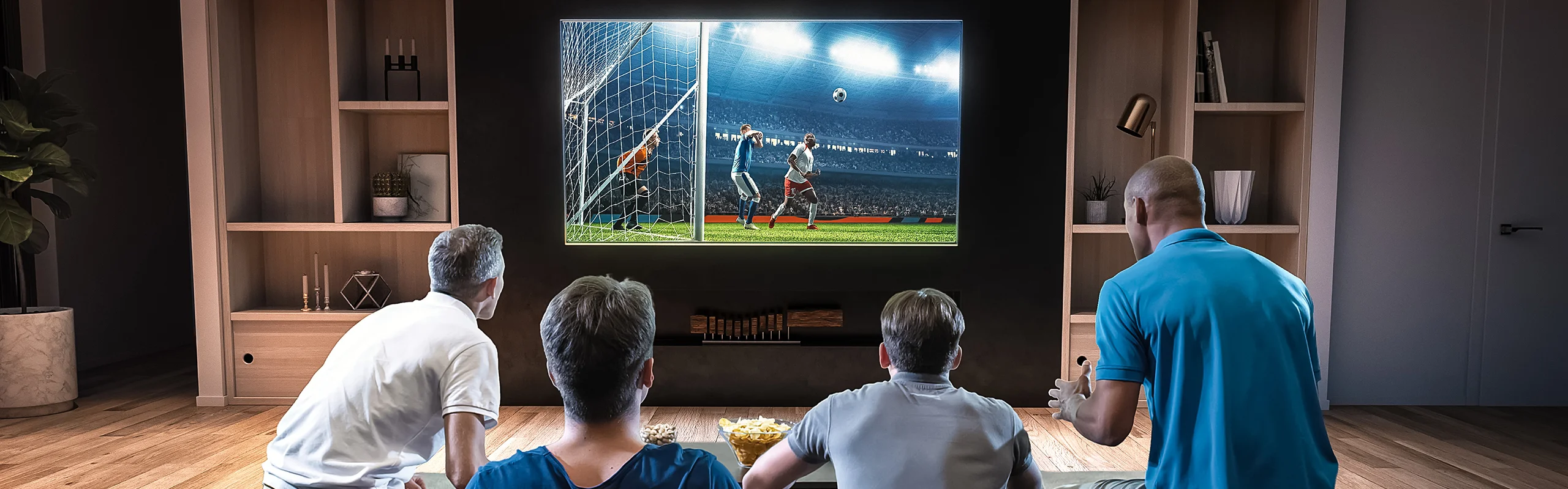 Group of men watching sports on 4K TV