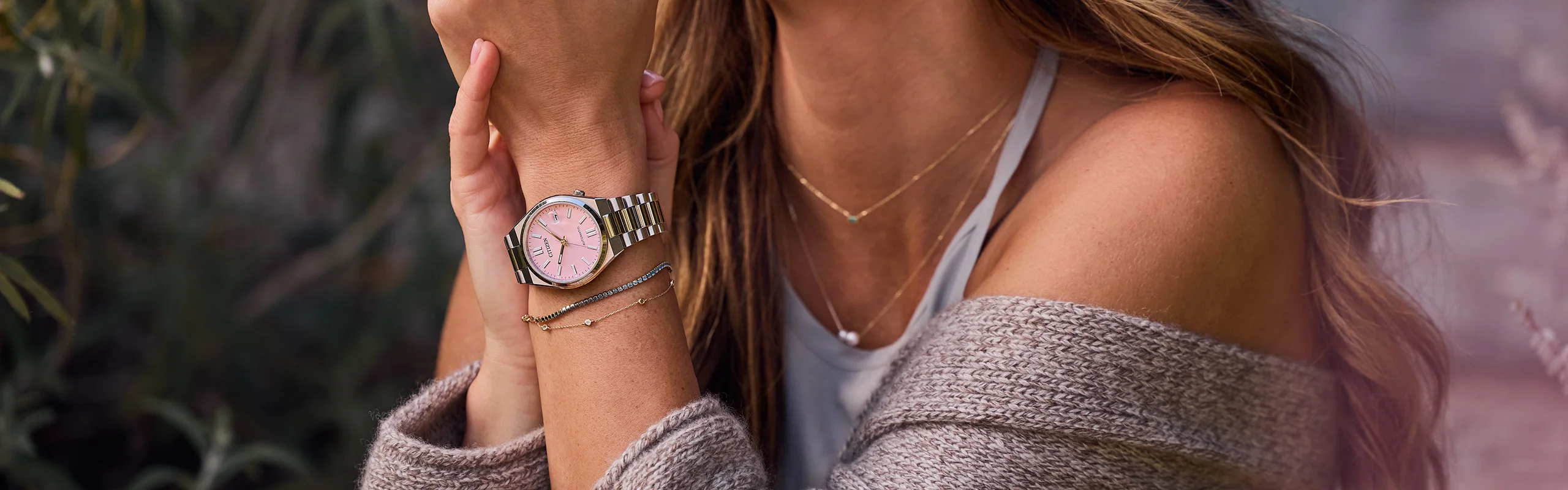 A woman wearing a Tsuyosa watch in pink