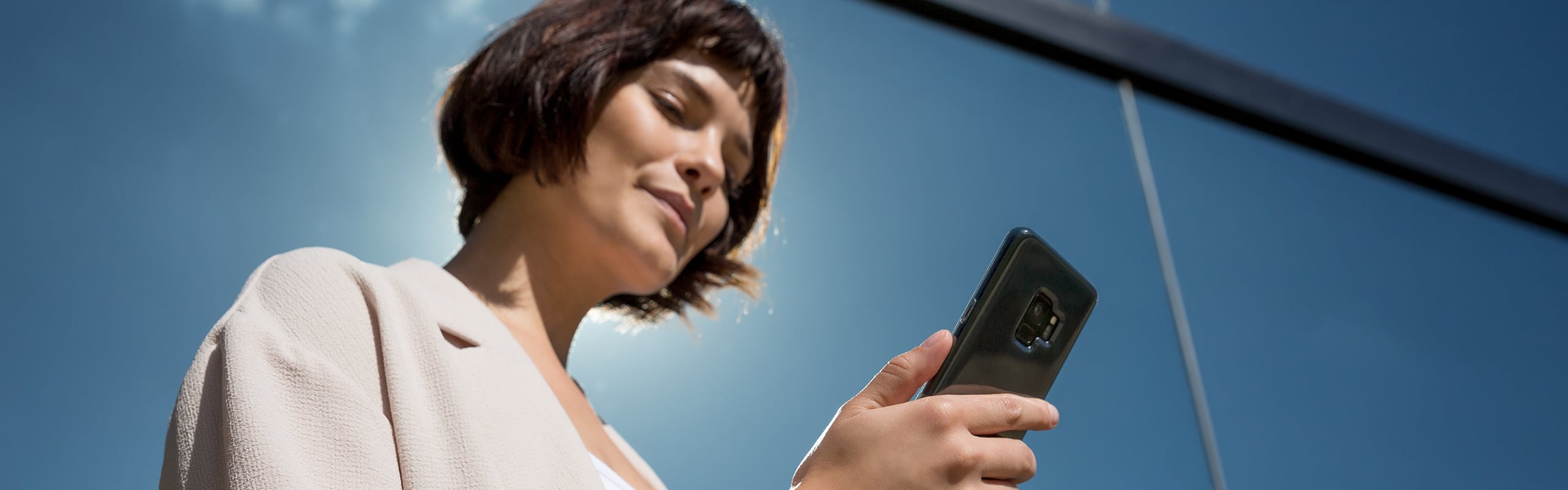 Woman reading her cell phone