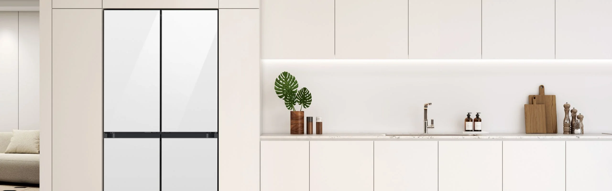 A white counter-depth Samsung Bespoke four-door refrigerator in a white kitchen.