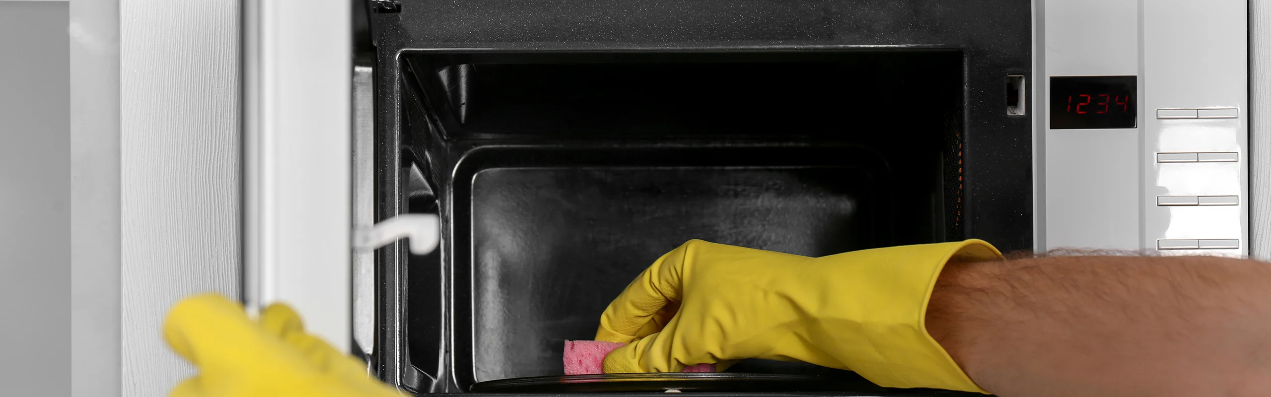 Cleaning a microwave with a sponge