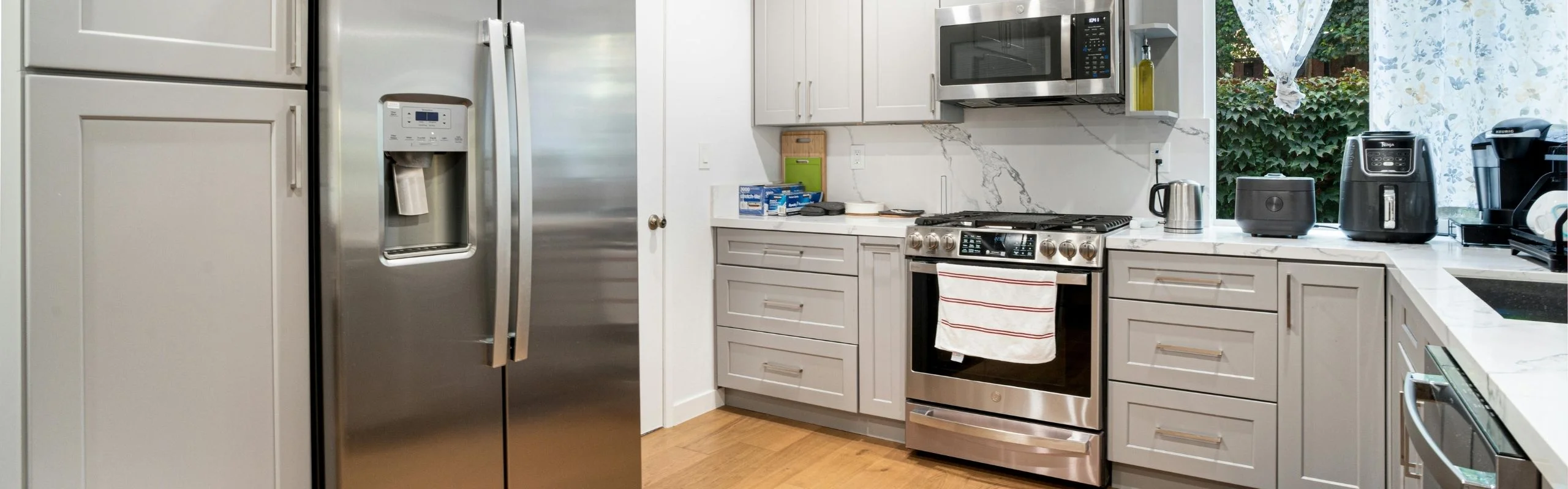 A modern kitchen with stainless steel appliances.