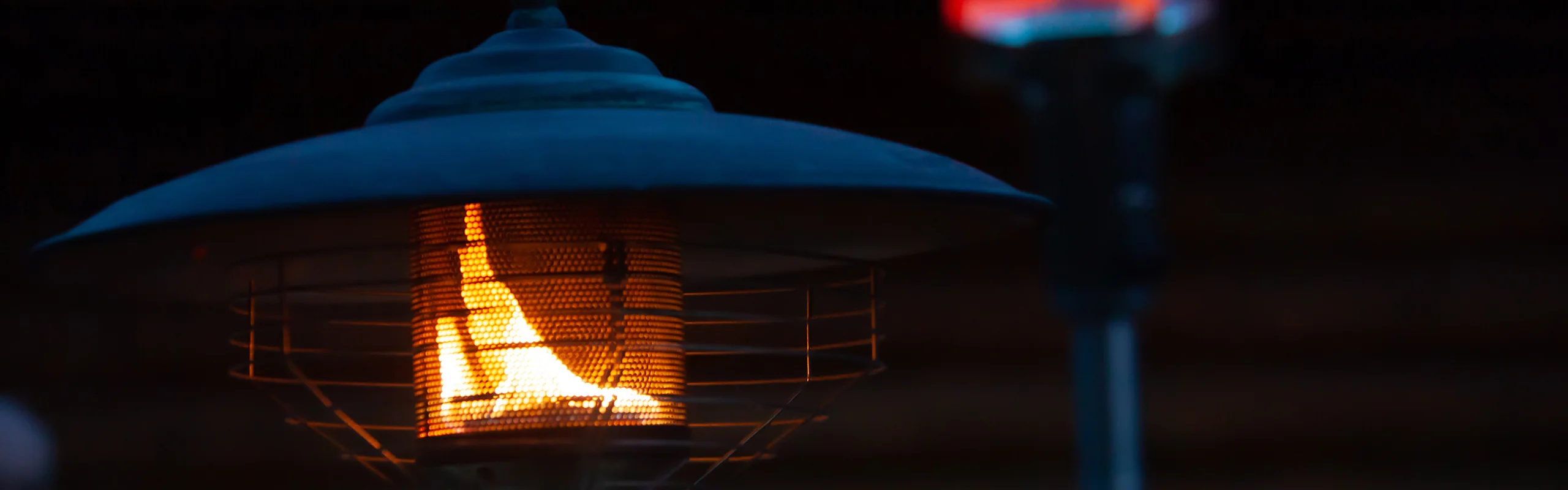 Two lit patio heaters