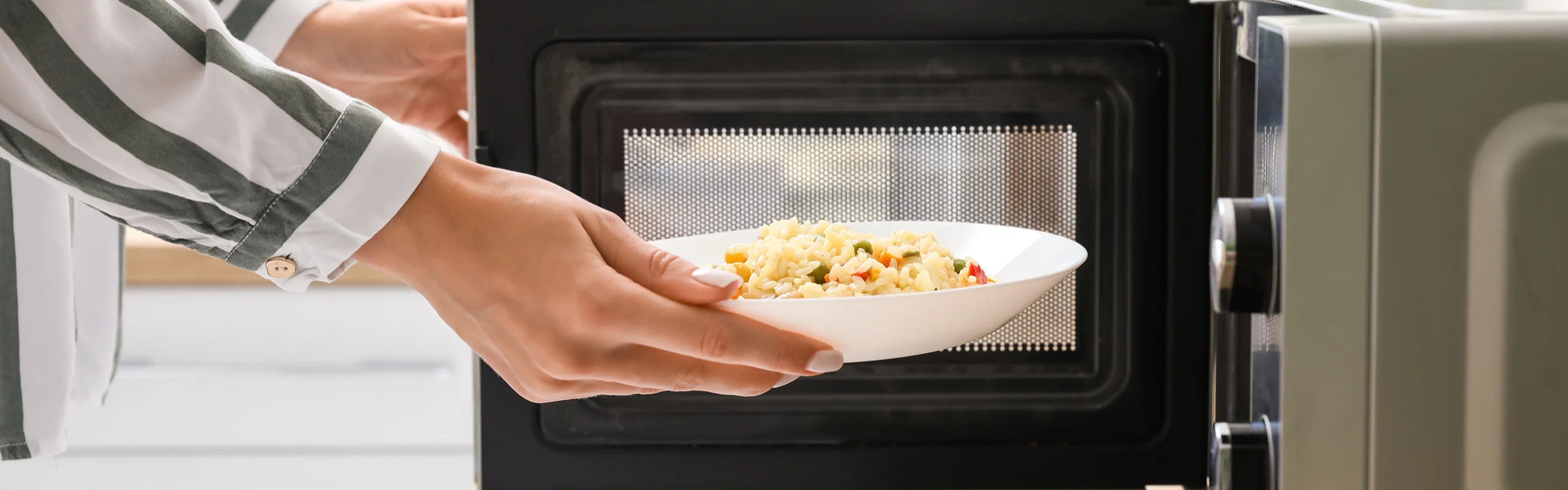 Rice in bowl going into microwave