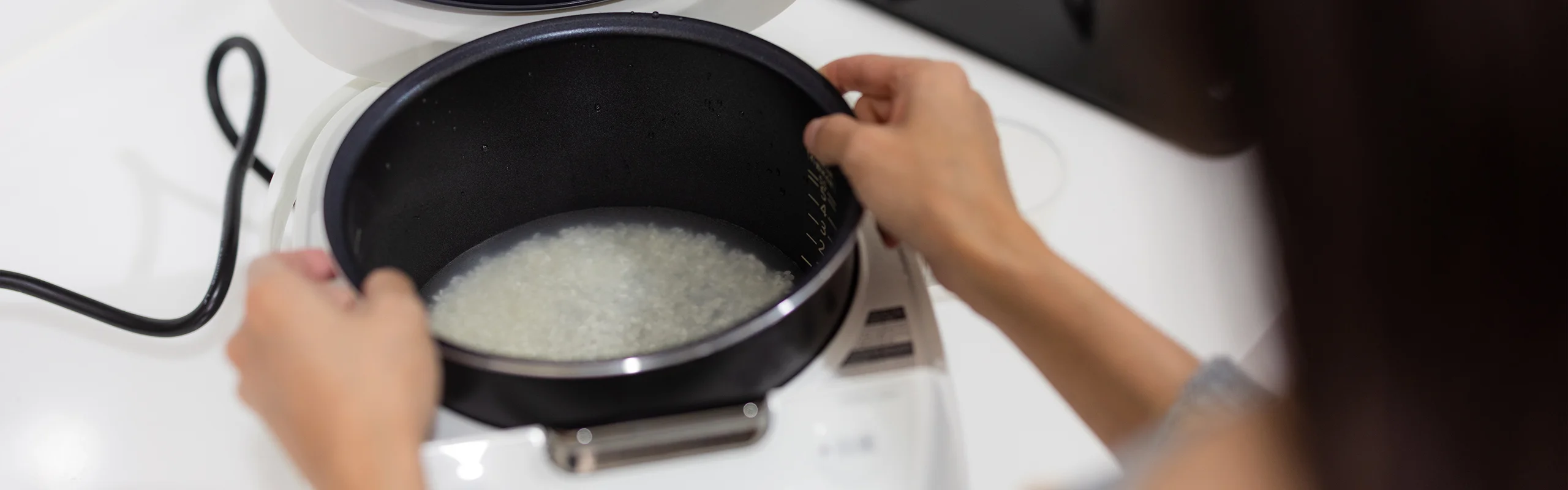 Rice with water in cooker