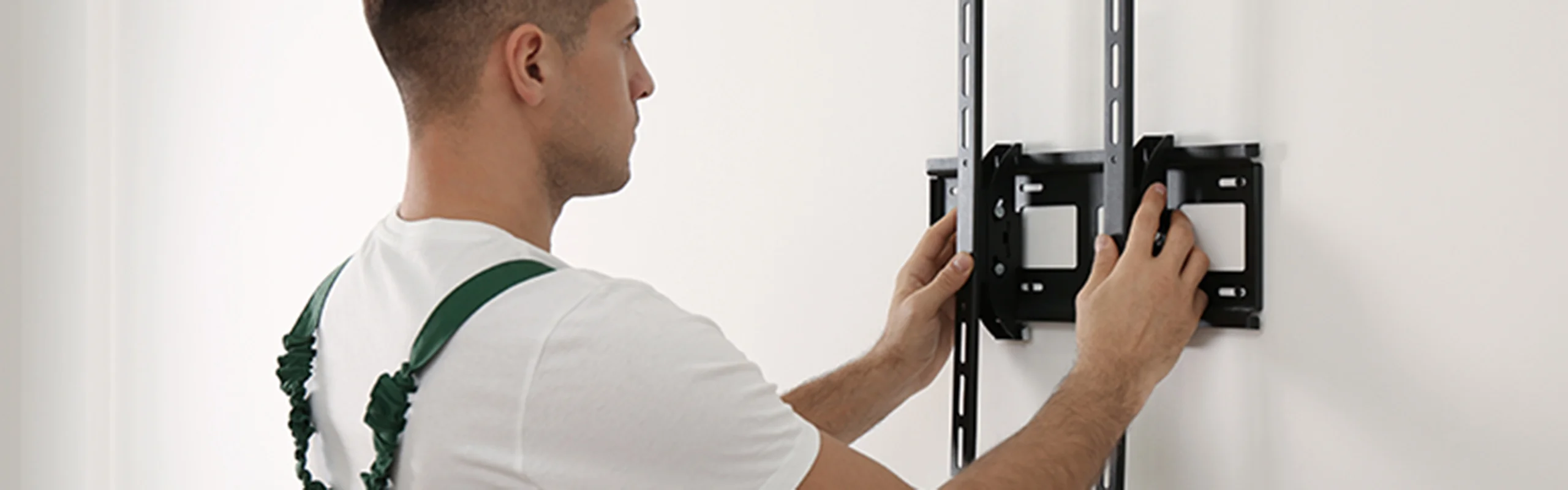 Man installing wall mount